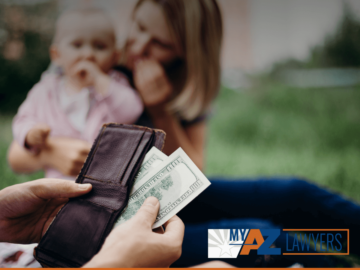 Father counting money for child support payment