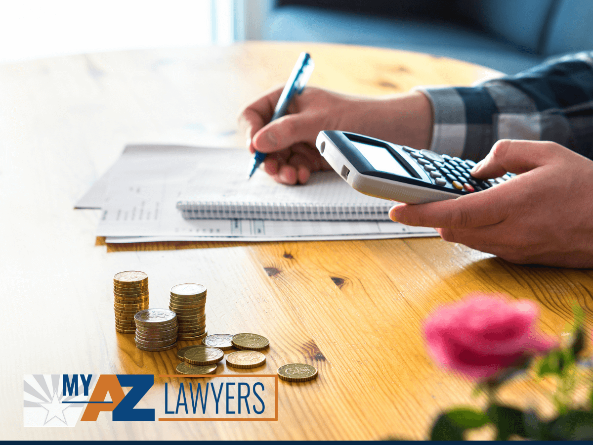 Man using calculator and counting budget after bankruptcy