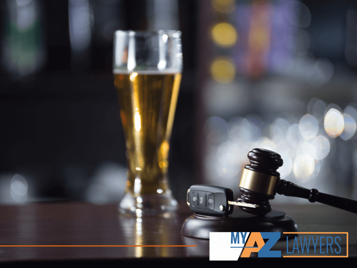 Glass of beer and car keys, driving under the influence charges and their long terms effects