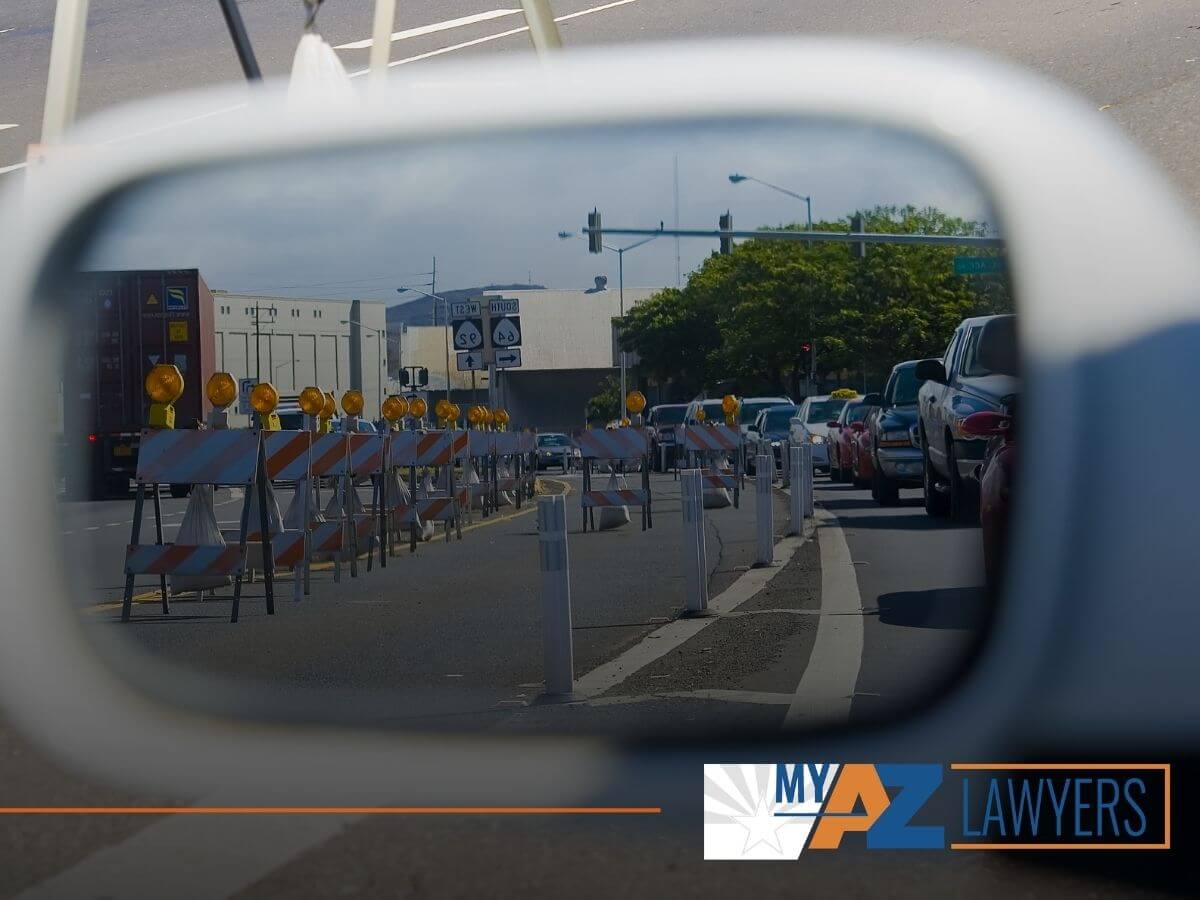 Car passing by a construction zone on the freeway