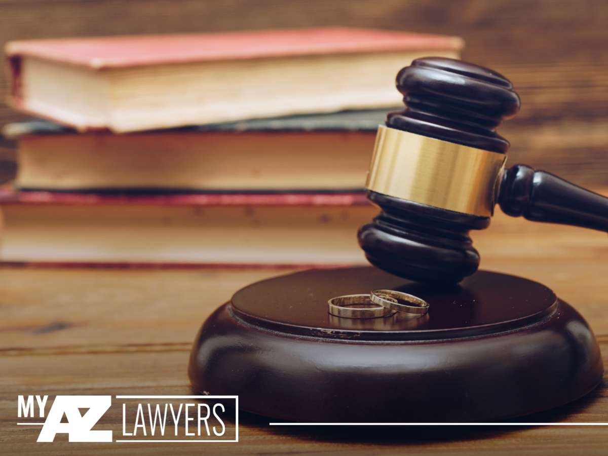Gavel and wedding rings symbolizing divorce proceedings in court