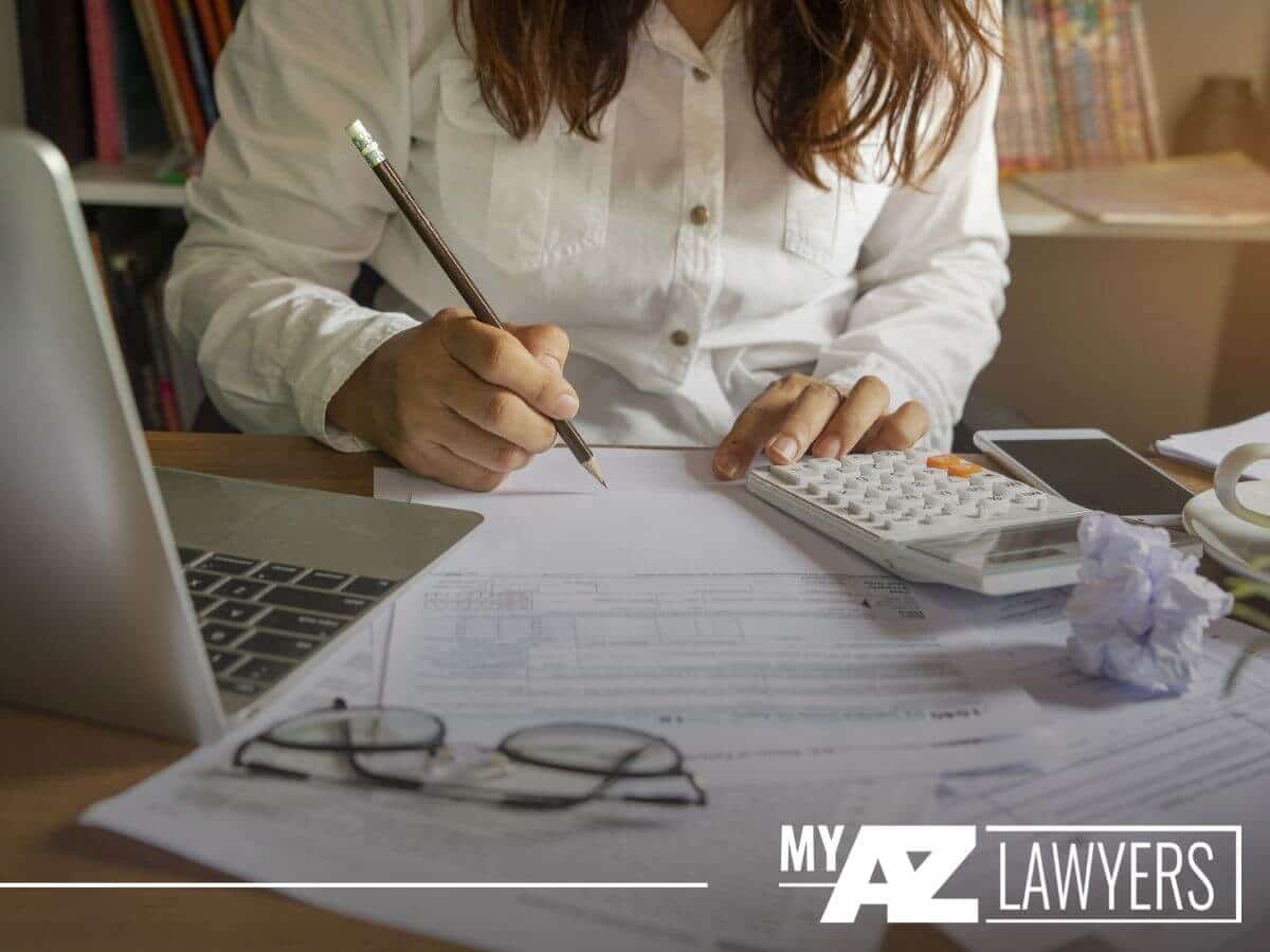 Woman reviewing documents for her tax return