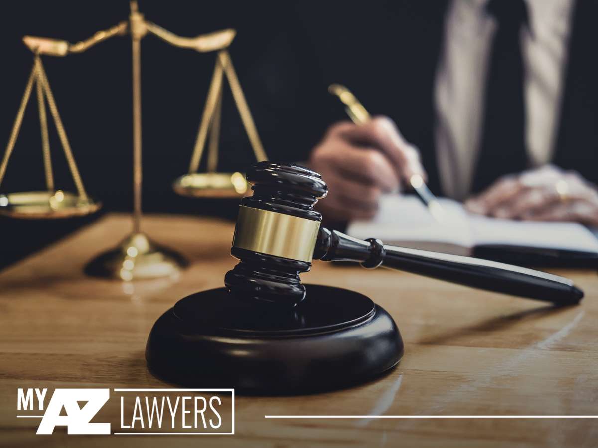 A close-up of a gavel on a desk with the scales of justice in the background, symbolizing legal proceedings, possibly related to a lender repossessing a vehicle