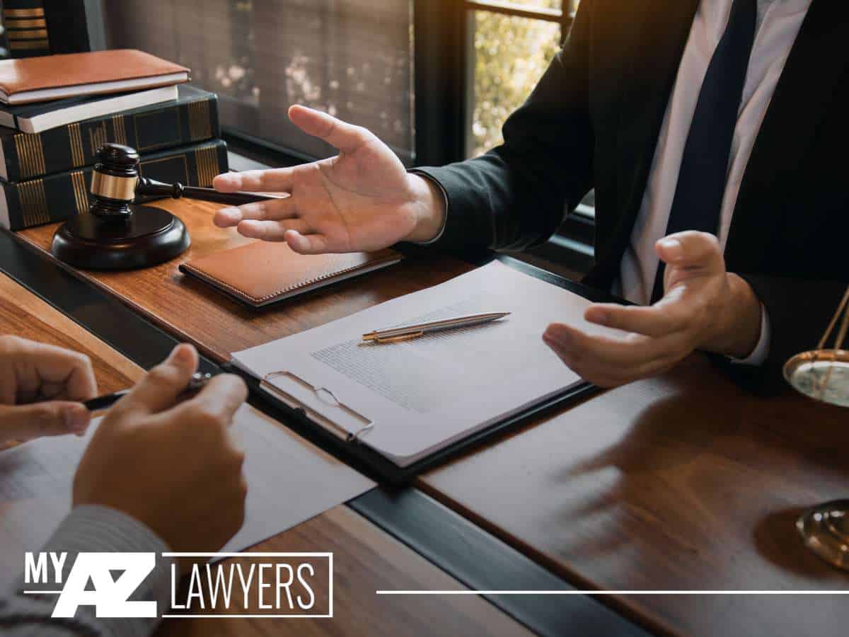 Lawyer consulting a client about accident claims at Dangerous Intersections in Arizona