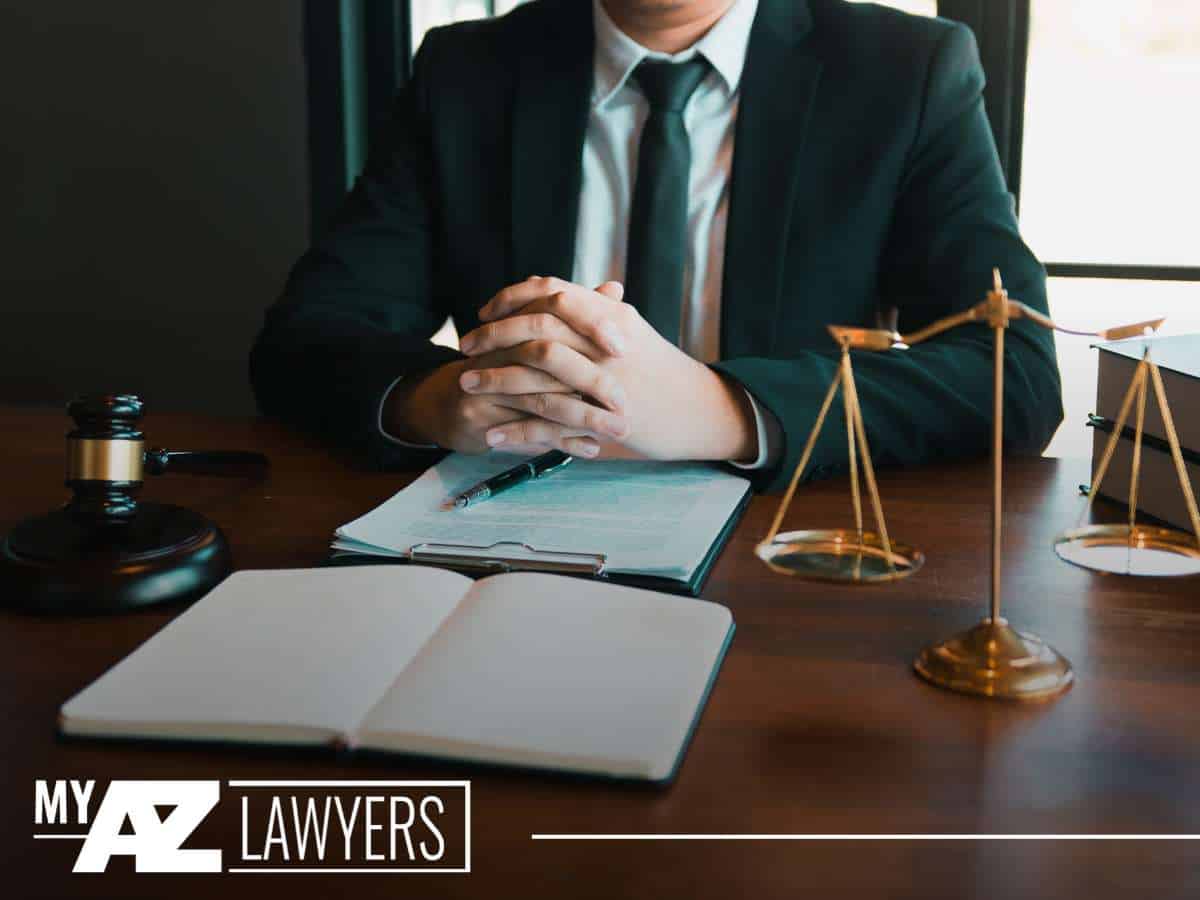 Bankruptcy attorney at desk with legal documents and scales