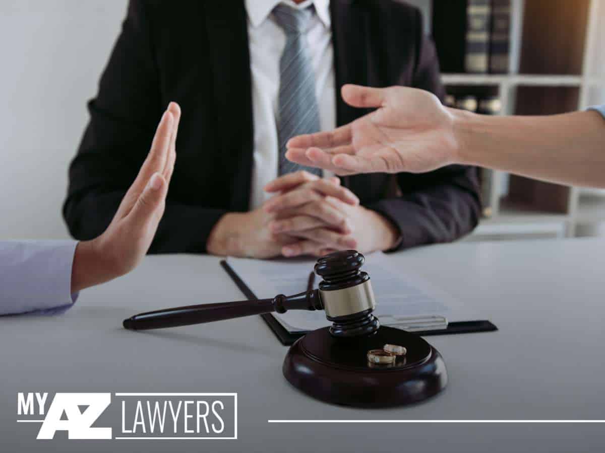 Divorce negotiation with legal documents, symbolizing the impact of breadcrumbing in marital disputes