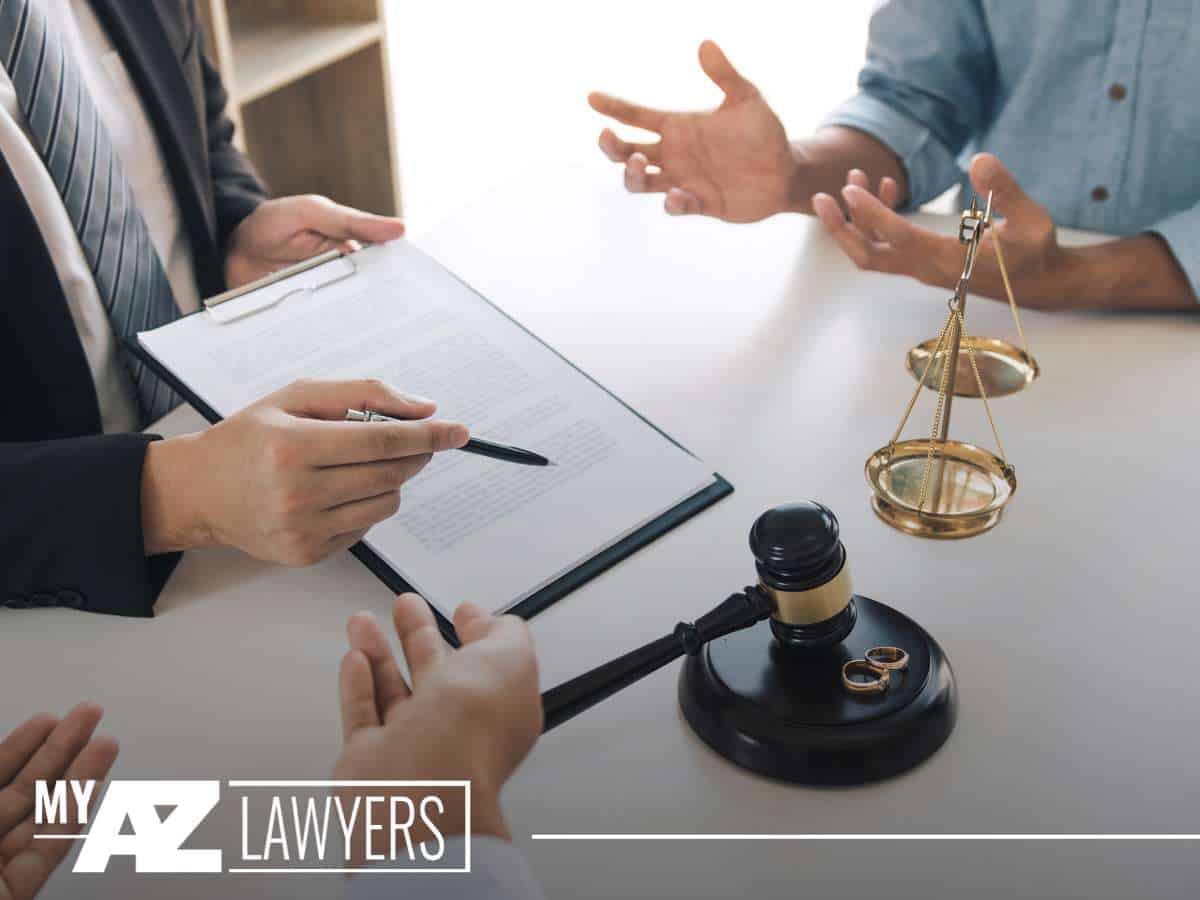 Lawyer discussing legal documents during a divorce consultation.